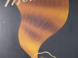 a large poster on the side of a building advertising a hair salon