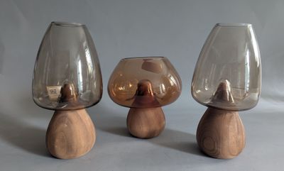 three glass vases sitting on top of each other