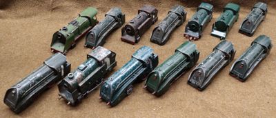 a lot of toy trains that are on the ground