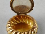 an image of a gold ring with a glass in the middle
