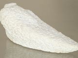 a white object that looks like a banana on a table