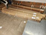 many boxes of cardboard sitting on the floor in a room