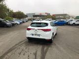 a white car that is parked in a parking lot