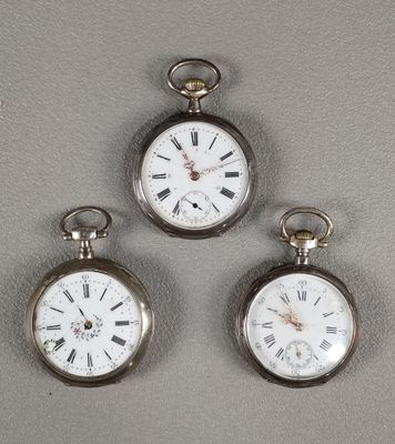 three silver pocket watches with roman numerals and roman numerals on them