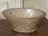 a glass bowl sitting on a table in a room