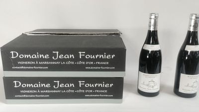 three bottles of wine are sitting next to each other on a table
