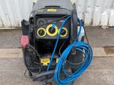 an image of a welding machine with a hose attached to it