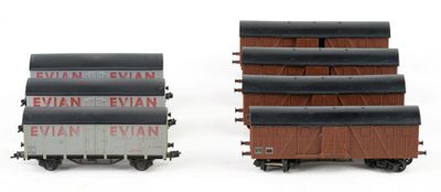 two train cars that are sitting next to each other