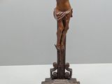 a statue of jesus on a cross on a table