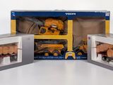 three boxes of toys that are sitting on a table