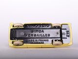 a yellow and black bus that is sitting on a table