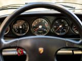 steering wheel of a car with gauges and speedometers on it