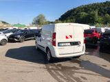 a white van that is parked in a parking lot