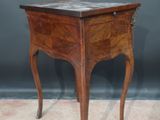 an image of a small wooden table with a marble top
