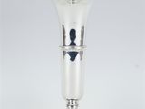 an image of a silver vase sitting on top of a white table