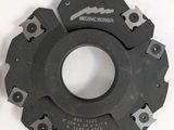 two circular cutters on top of each other on a white surface