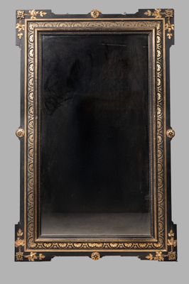 an antique black and gold mirror with a gold frame
