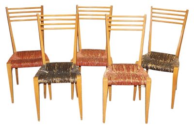 four chairs that are sitting next to each other