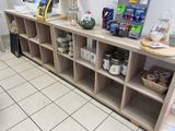 a shelf with various items on it in a store