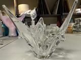 a glass bird that is sitting on a table