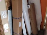 a pile of boxes and other items in a room