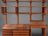 a wooden shelf with two drawers and a desk on top of it