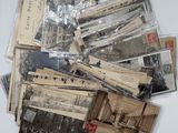 a pile of old postcards sitting on a table