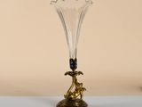 a glass vase that is sitting on a table