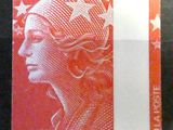 a close up of a stamp with a woman ' s face on it
