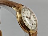 an image of a close up of a wrist watch on a white surface