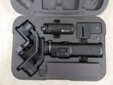 a black case with a camera and other items in it