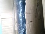 a box that has a roll of blue plastic on it