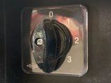 a close up of a black knob on a microwave