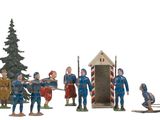 a lot of figurines that are on a white surface