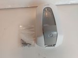 a toilet paper dispenser attached to the wall