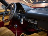 a dashboard and steering wheel of a car in a garage