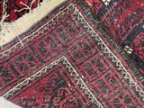 an image of a close up of a red and black rug