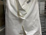 a picture of a pair of white pants hanging on a rack