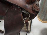 a close up of a saddle on a horse in a room