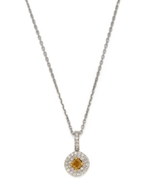 a yellow sapphire and diamond pendant on a chain