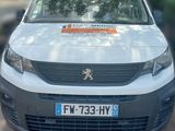 a white van that is parked on the side of the road