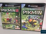deux boîtes de jeux vidéo « Pikmin » et « Pikmin » posées sur une table