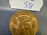a close up of a gold coin with a label on it