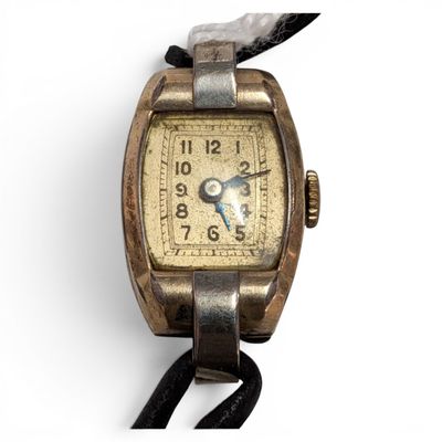 an image of a wrist watch with a leather strap on a white background