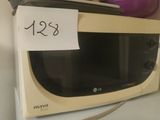 a microwave with a price tag on it sitting on a counter