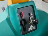 a blue gas tank with a yellow handle on it