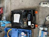 a box of tools and a pair of shoes on the ground