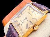 a watch that is sitting on top of a wooden box