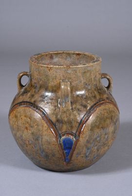 a brown vase with a blue decoration on it