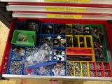a drawer full of assorted items in a store